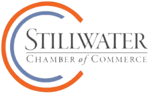 Stillwater Chamber of Commerce logo with orange and blue curved lines around the text. -JRPMTS
